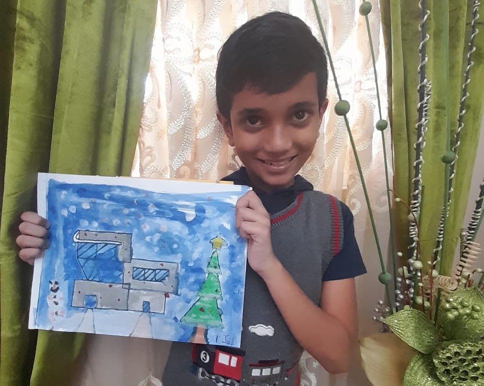 One of our students in his ugly t-shirt design and Christmas craft.