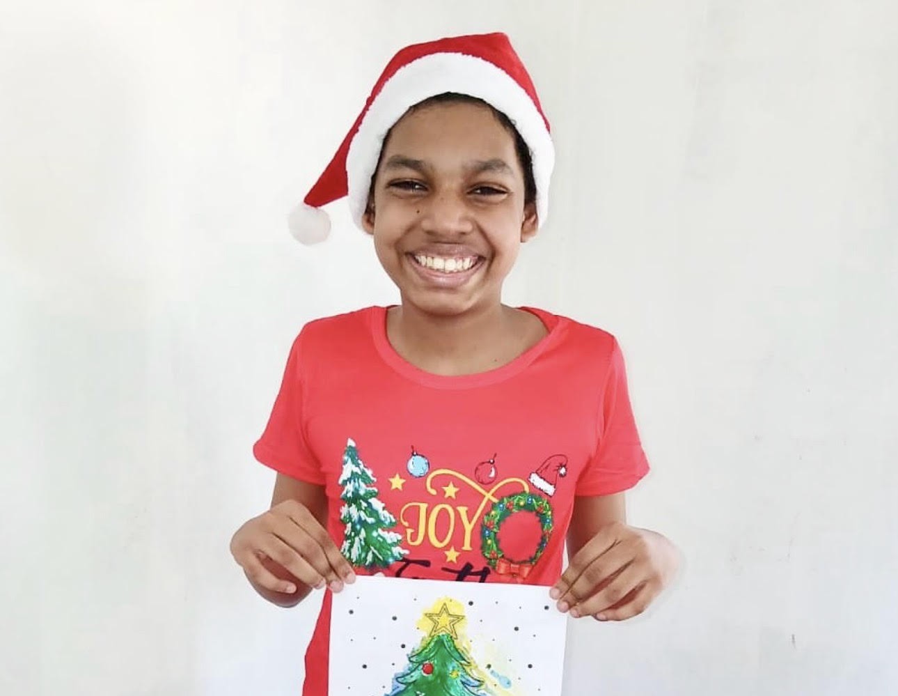 Kai in his ugly t-shirt design and Christmas craft.