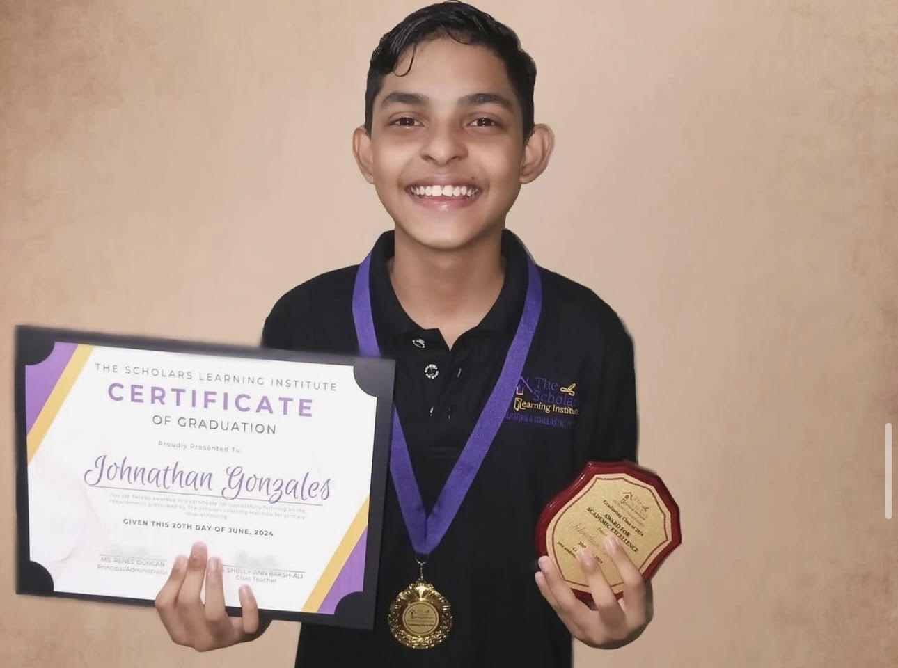 Johnathan on STD 5 graduation day.