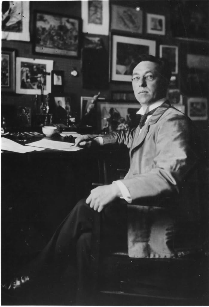 Vintage gelatin silver photograph showing Wassily Kandinsky seated at his desk in his Munich studio circa 1913 with framed ar