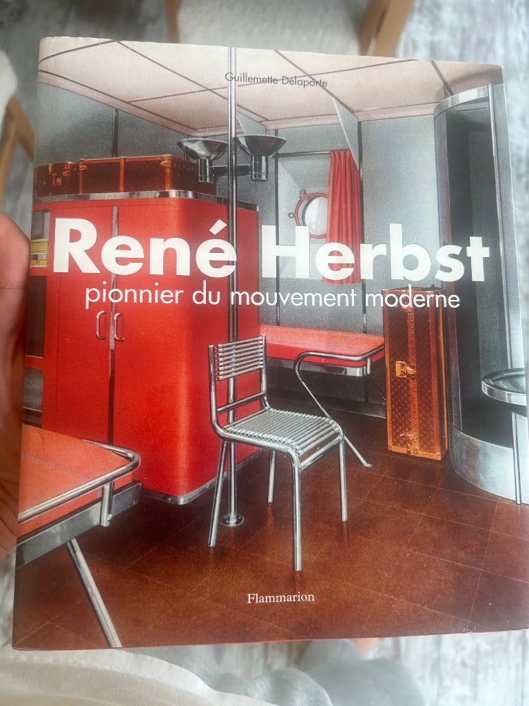 First edition cover of Guillemette Delaporte monograph on René Herbst published by Flammarion showing modernist tubular steel
