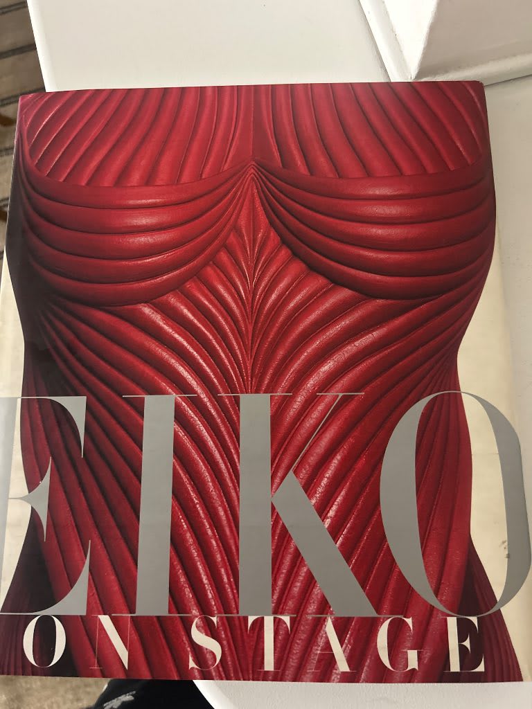 Eiko on Stage first edition dust jacket featuring iconic sculptural red corset from Bram Stoker's Dracula costume design