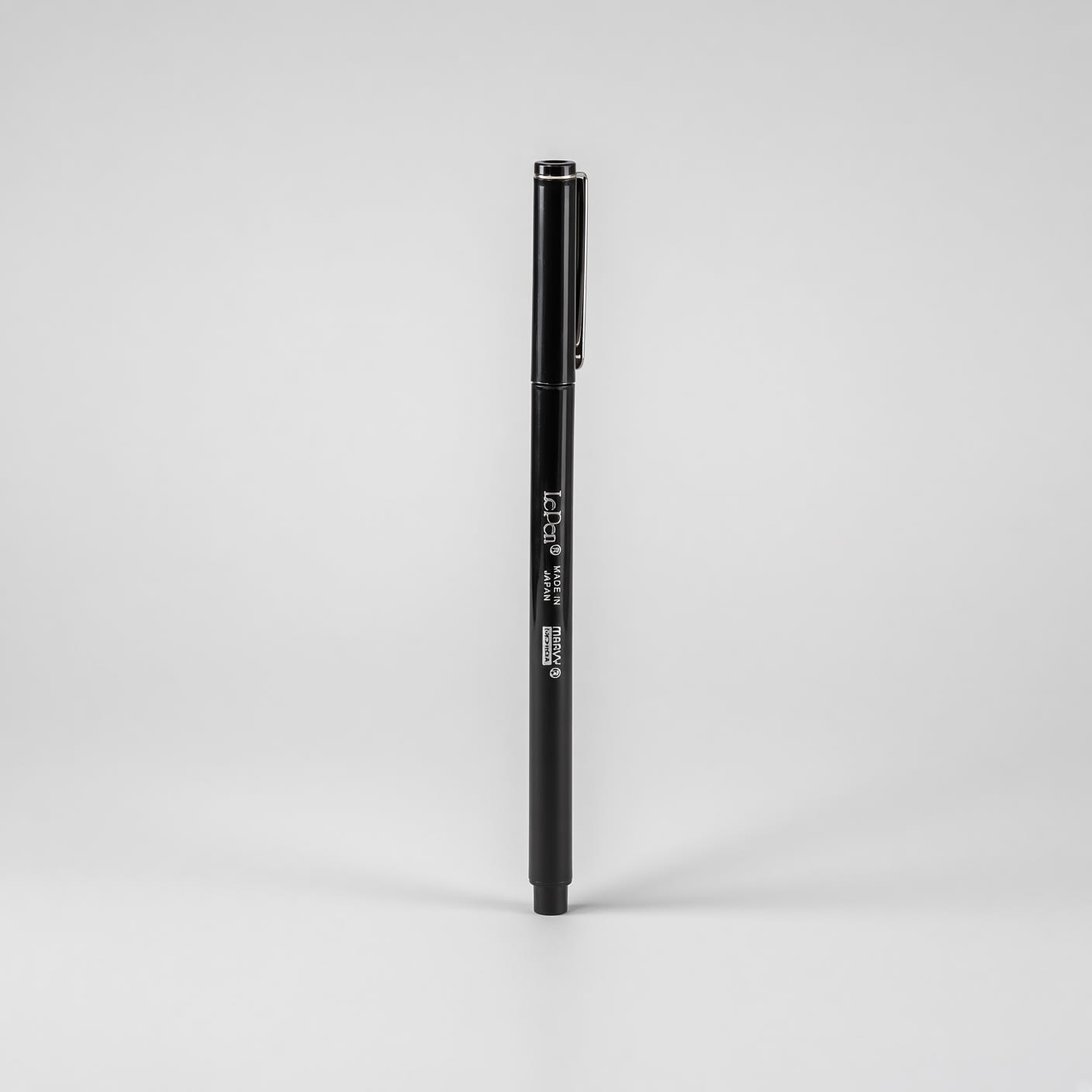 Black capped pen turned to show its clip.