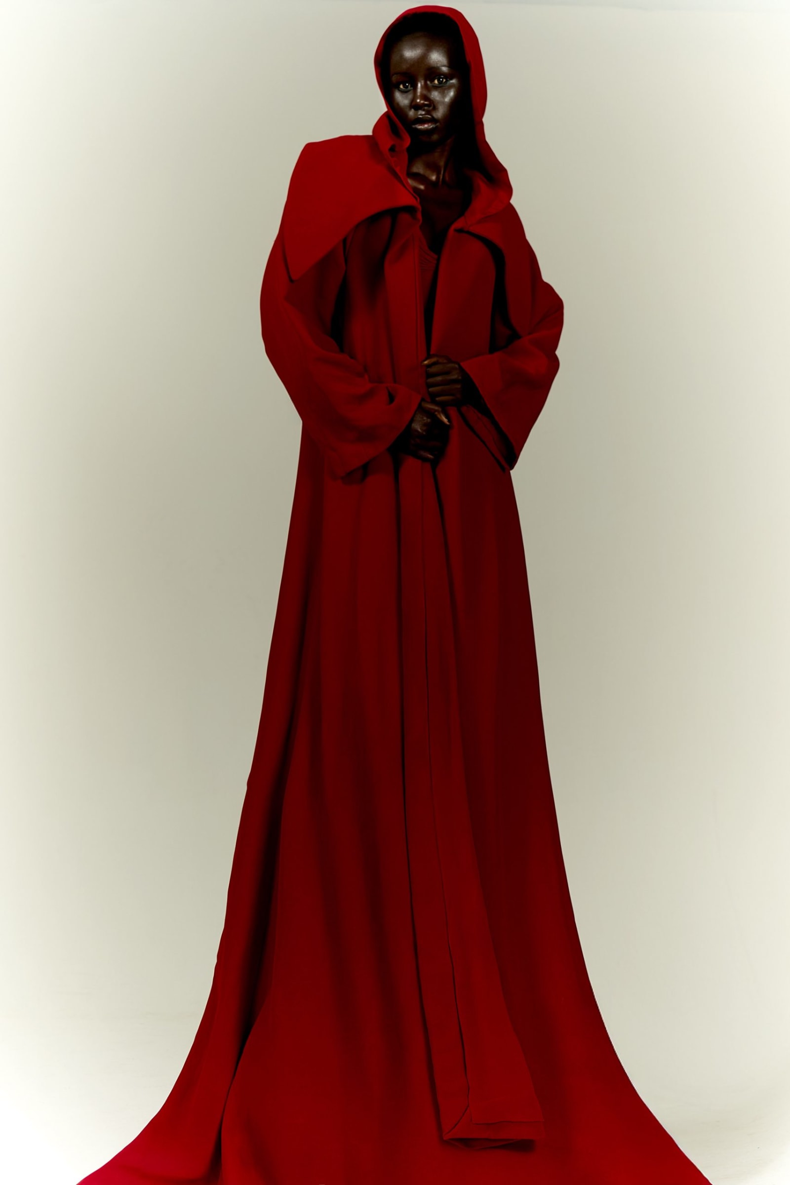 Gown and cape by GEORGES HOBEIKA, jewelry by ALEXIS BITTAR