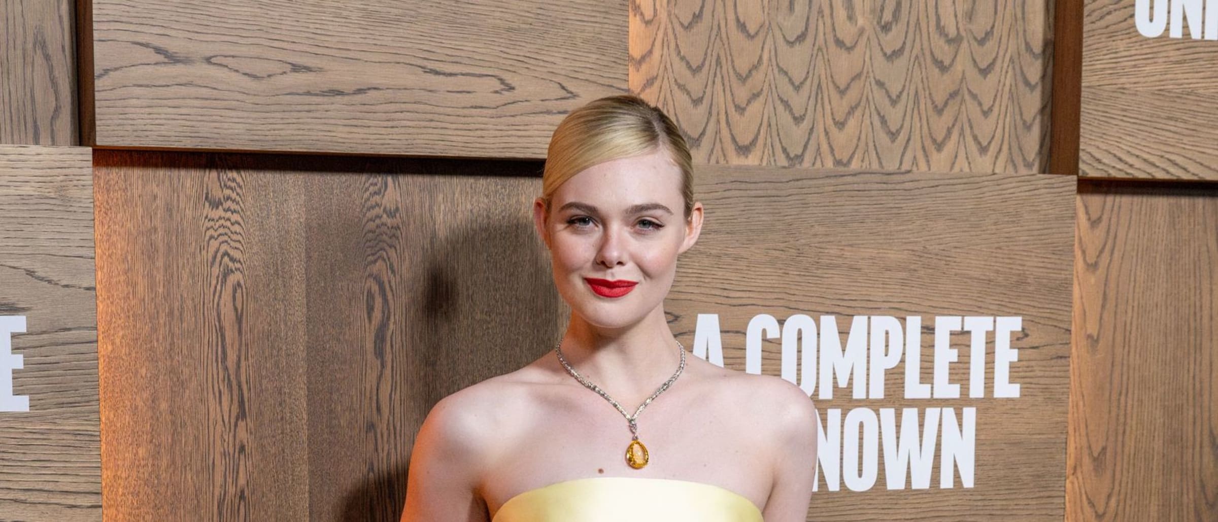 Elle Fanning Channels Old Hollywood In Custom Prada At ‘A Complete Unknown’ Premiere