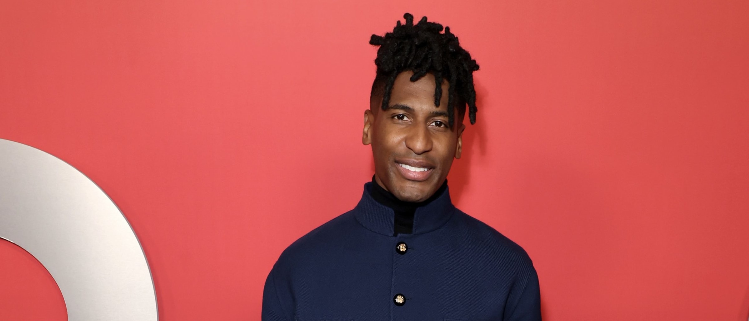 Jon Batiste Embraces Valentino ‘Avant les Débuts’ in Navy and Cream Prelude