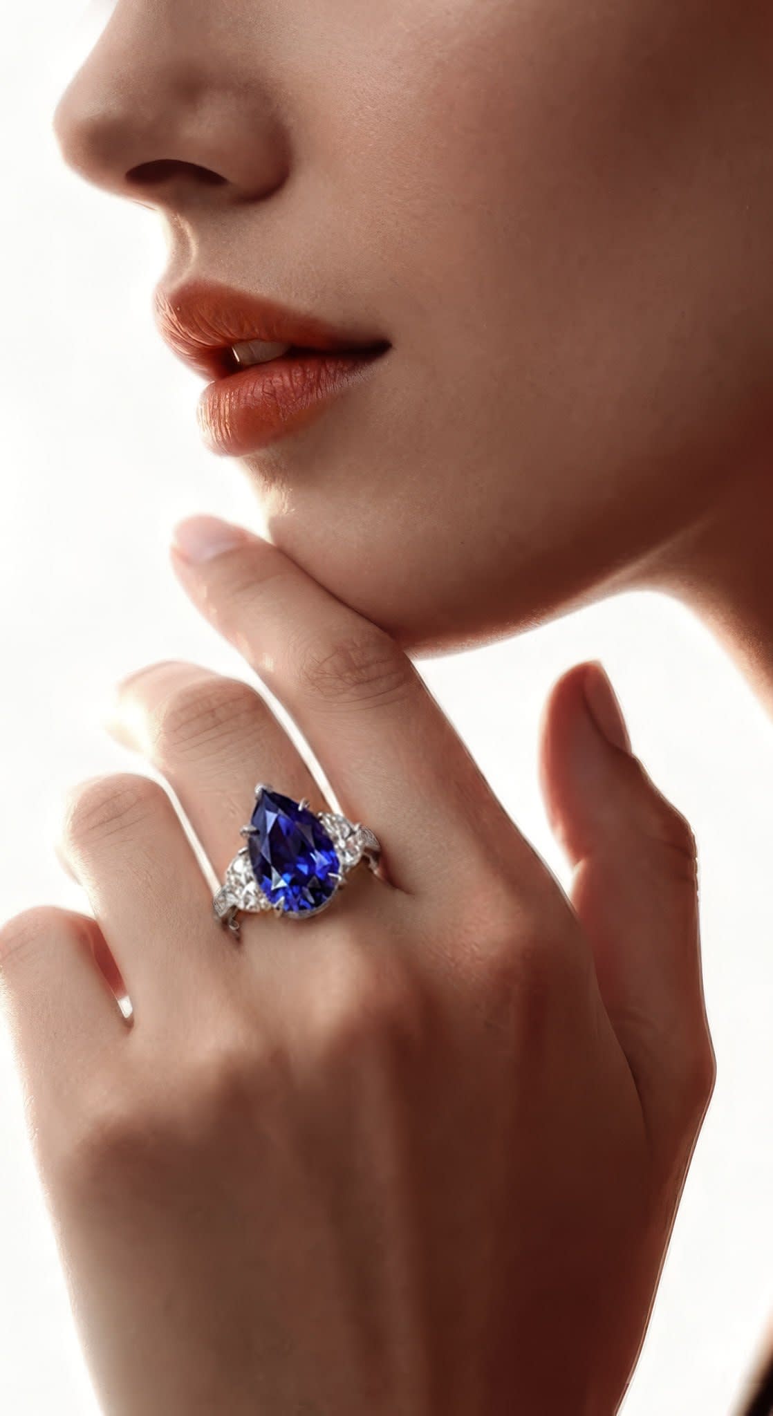 Pink-peach gemstone ring on model hand showing the warm flattering tones of fine morganite