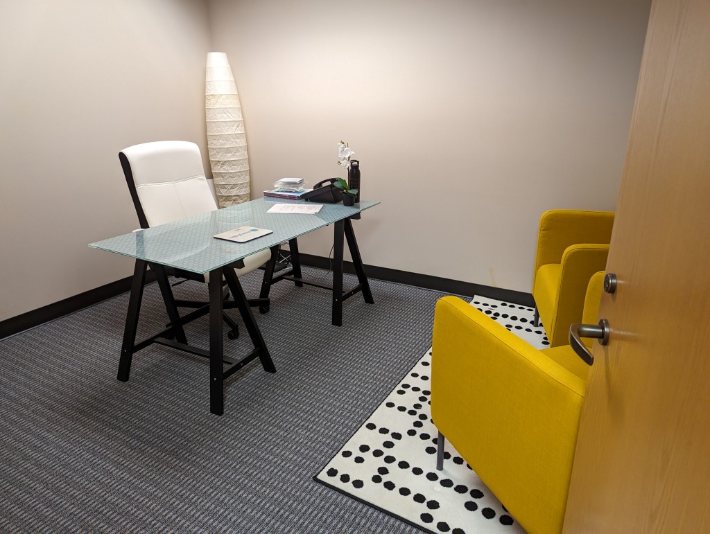 Private office with a modern yellow chair