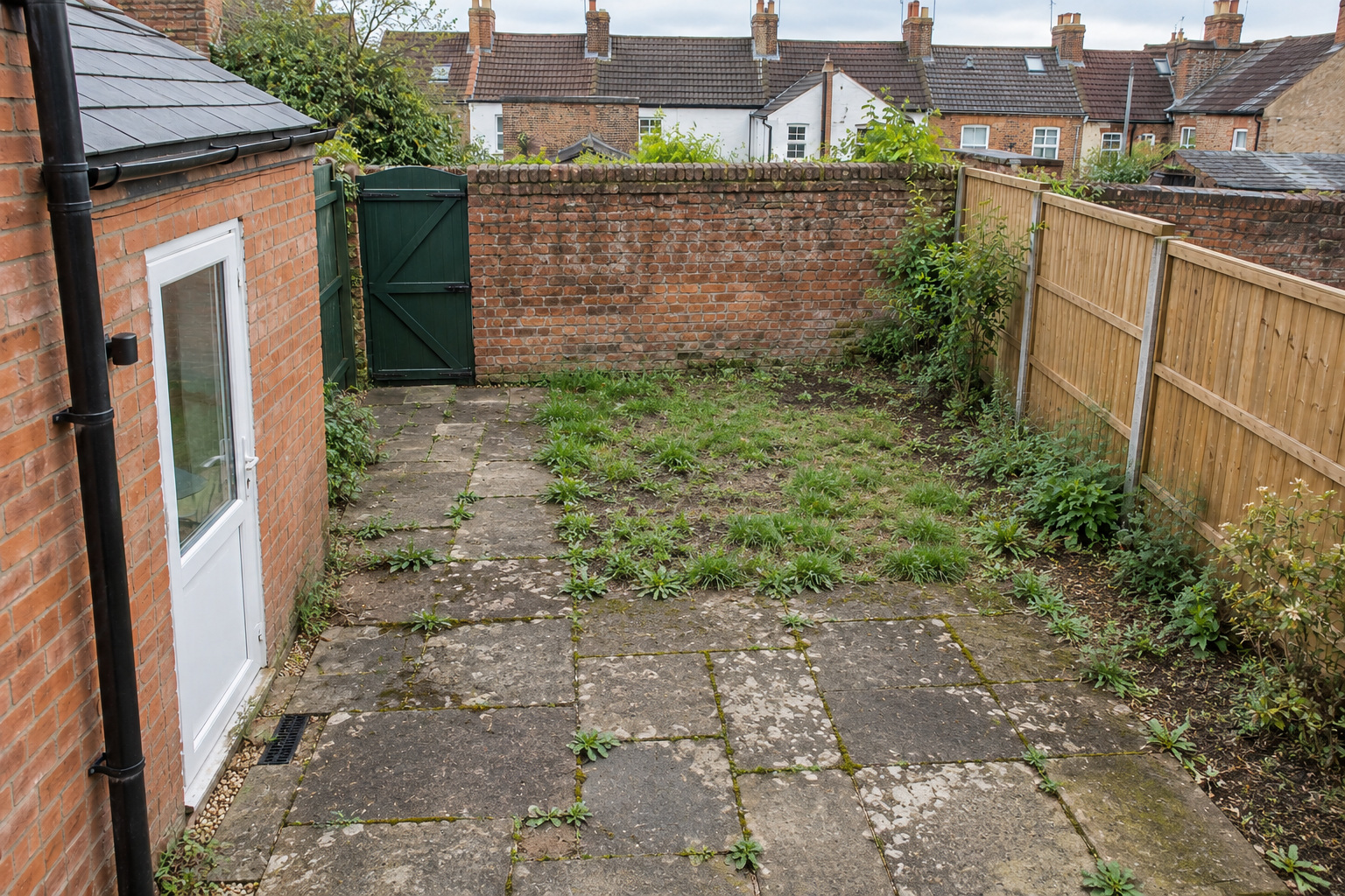 A neglected courtyard before landscaping.