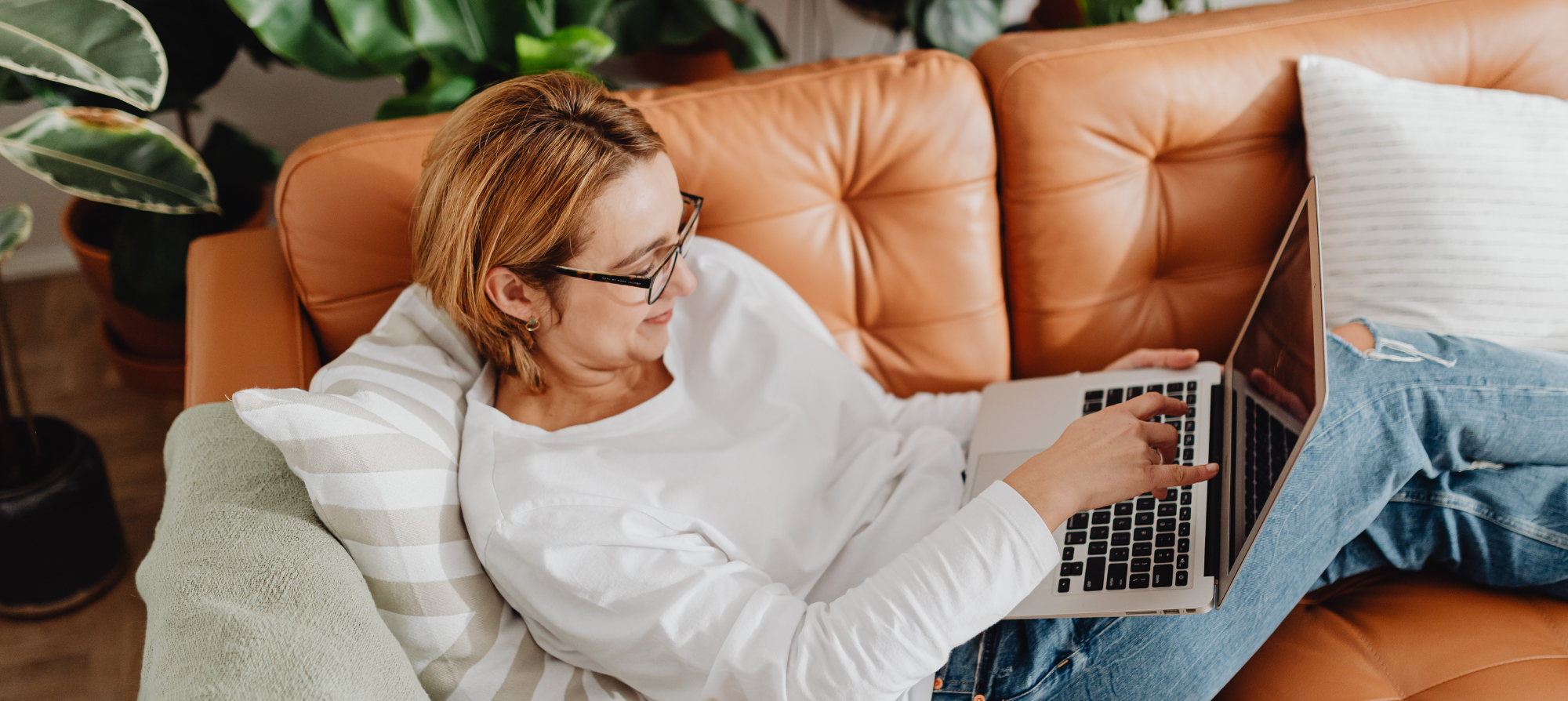Nutrition coach relaxing with her laptop — email marketing made simple