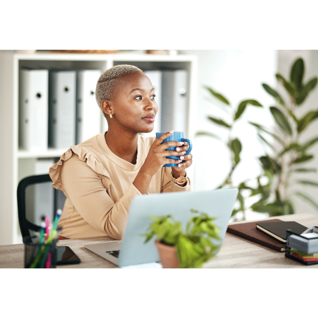 Woman reading email on laptop with coffee — email marketing for nutrition coaches