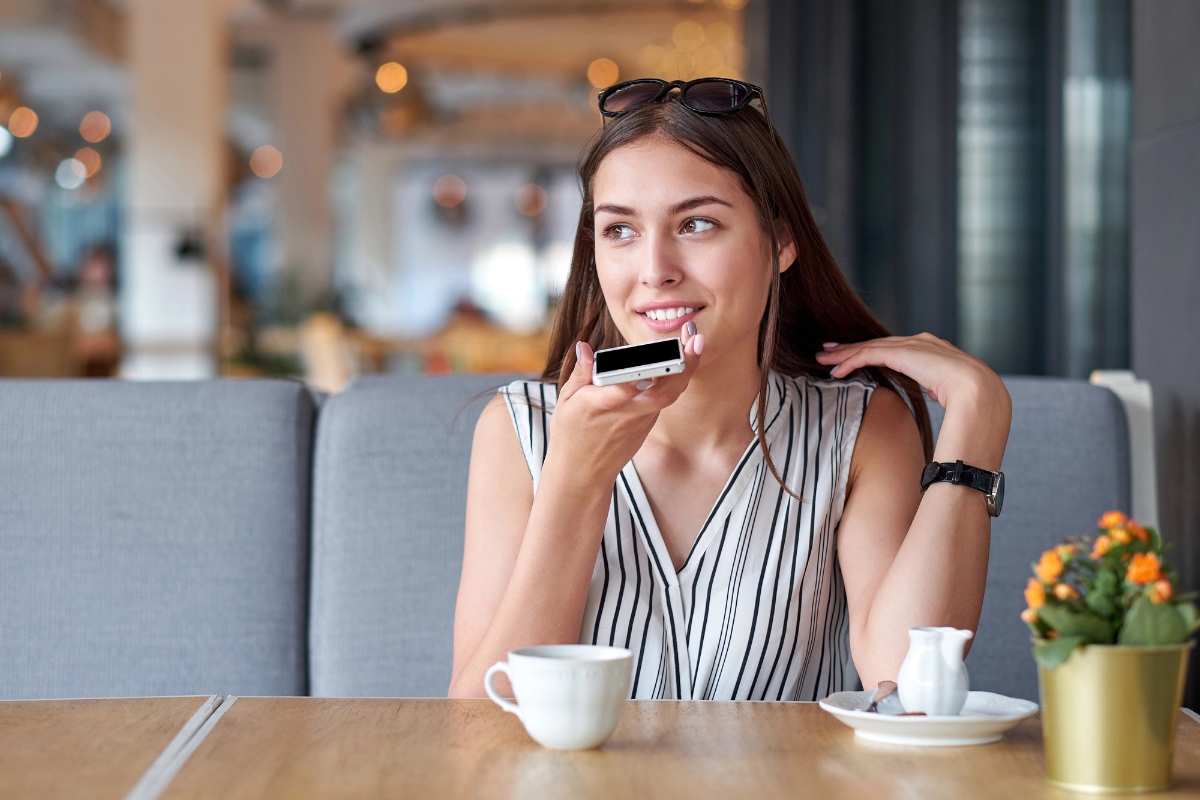 Woman on phone at cafe