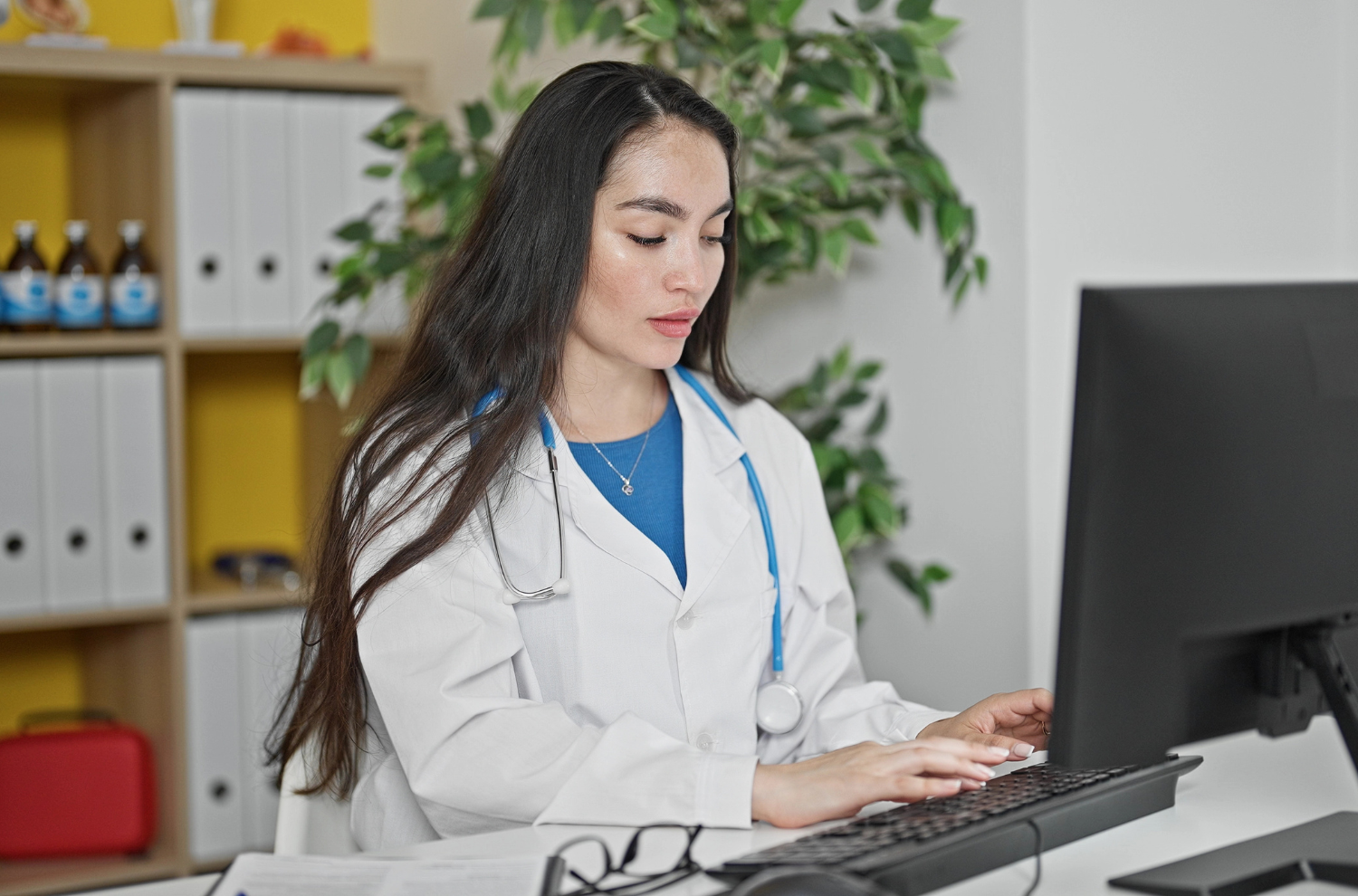 Women's health coach working at her desk