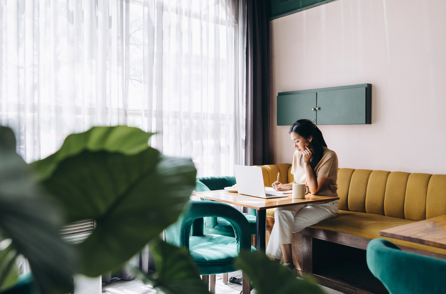 Woman sitting thoughtfully, representing a subscriber in the decision-making process