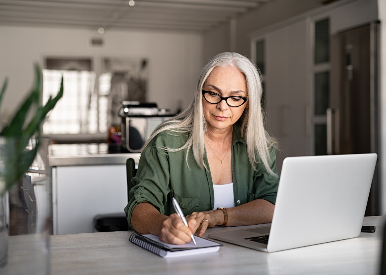 Health coach writing a thoughtful follow-up email after a client consultation