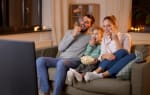 Famiglia che guarda un film Famiglia che guarda un film