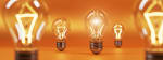 cinque_lampadine_su_sfondo_arancione cinque_lampadine_su_sfondo_arancione
