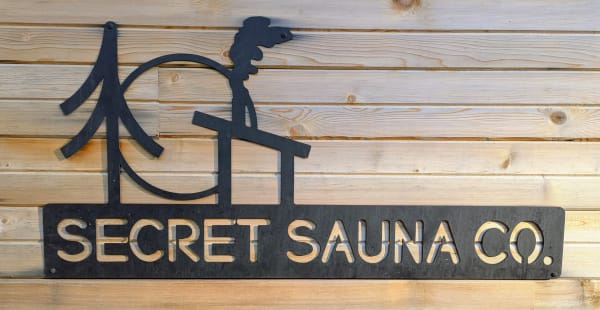 Custom sauna with panoramic window overlooking BC mountains