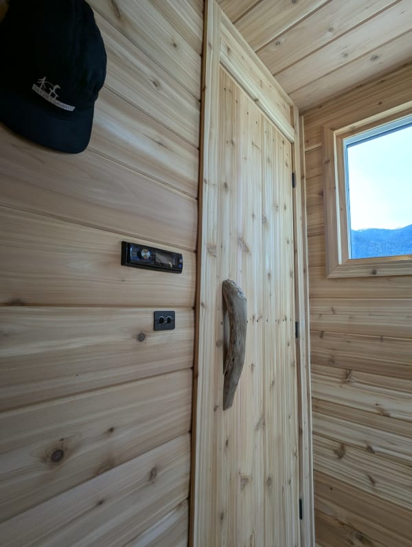 Sauna interior with warm ambient lighting and cedar walls