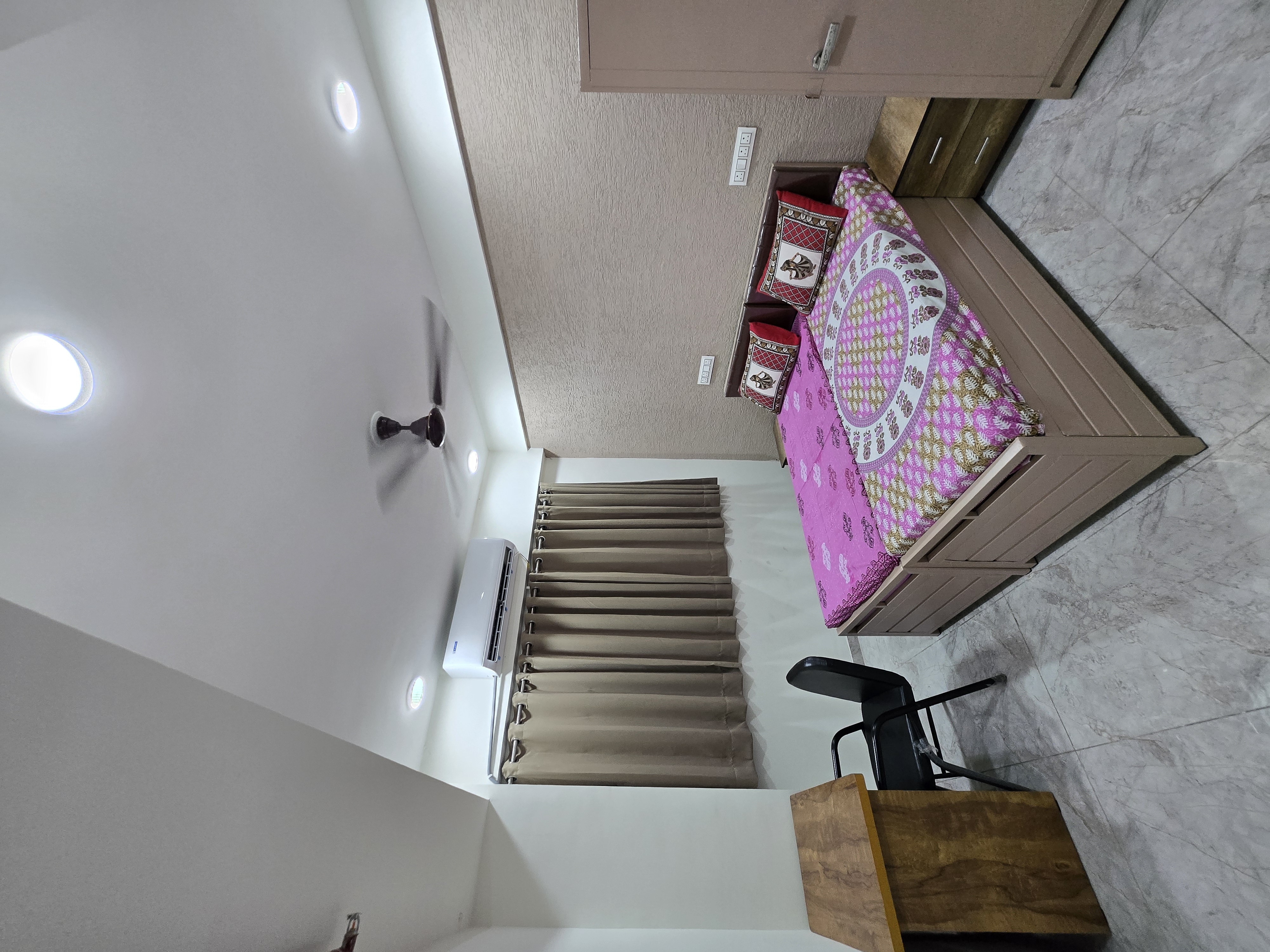 Single A.C. room interior view at Mansarovar Girls PG near GLS University, Ahmedabad