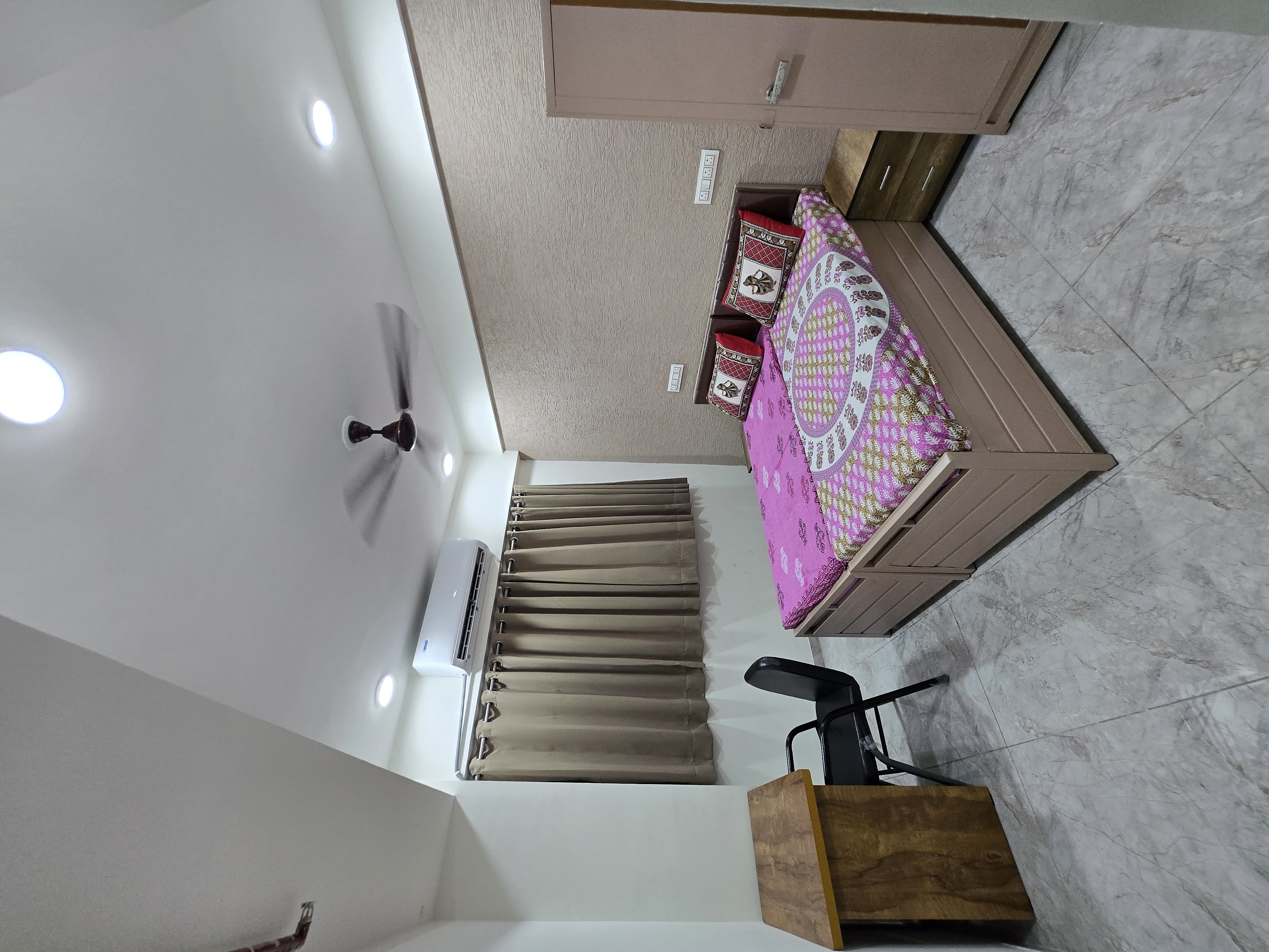 Single A.C. room for girls at Mansarovar PG, Navrangpura, Ahmedabad — private room with study desk