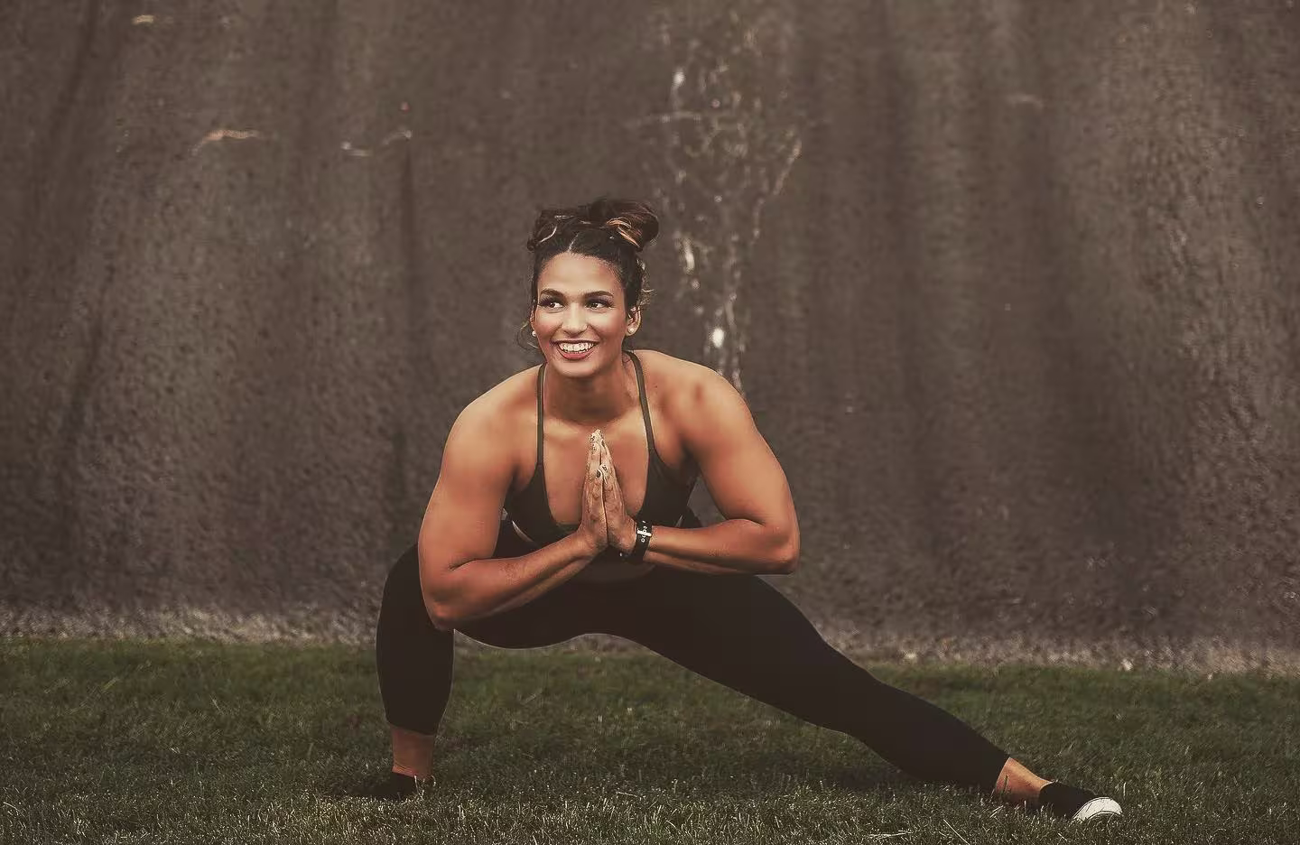Stephanie exercising in a field