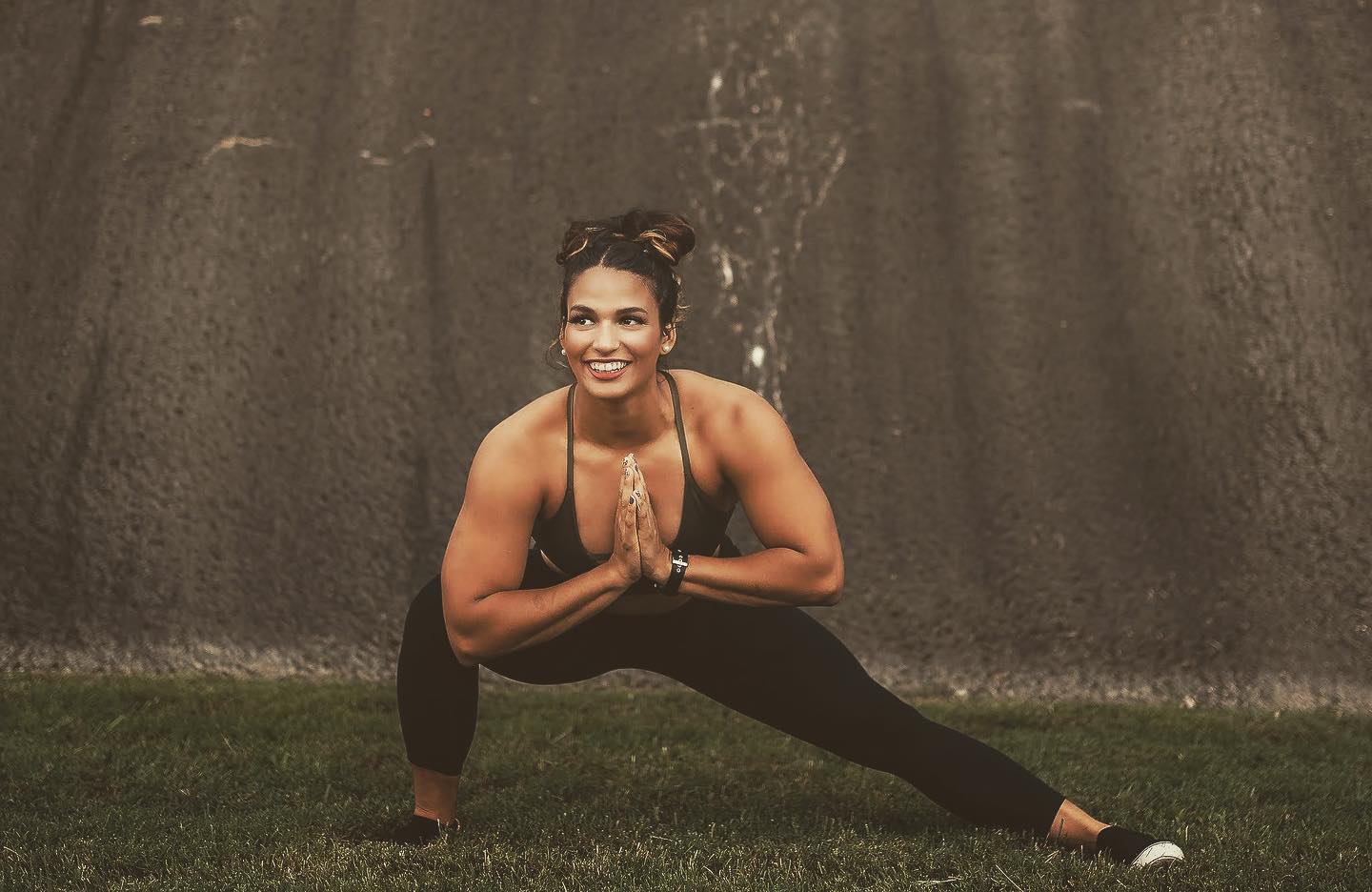 Stephanie exercising in a field