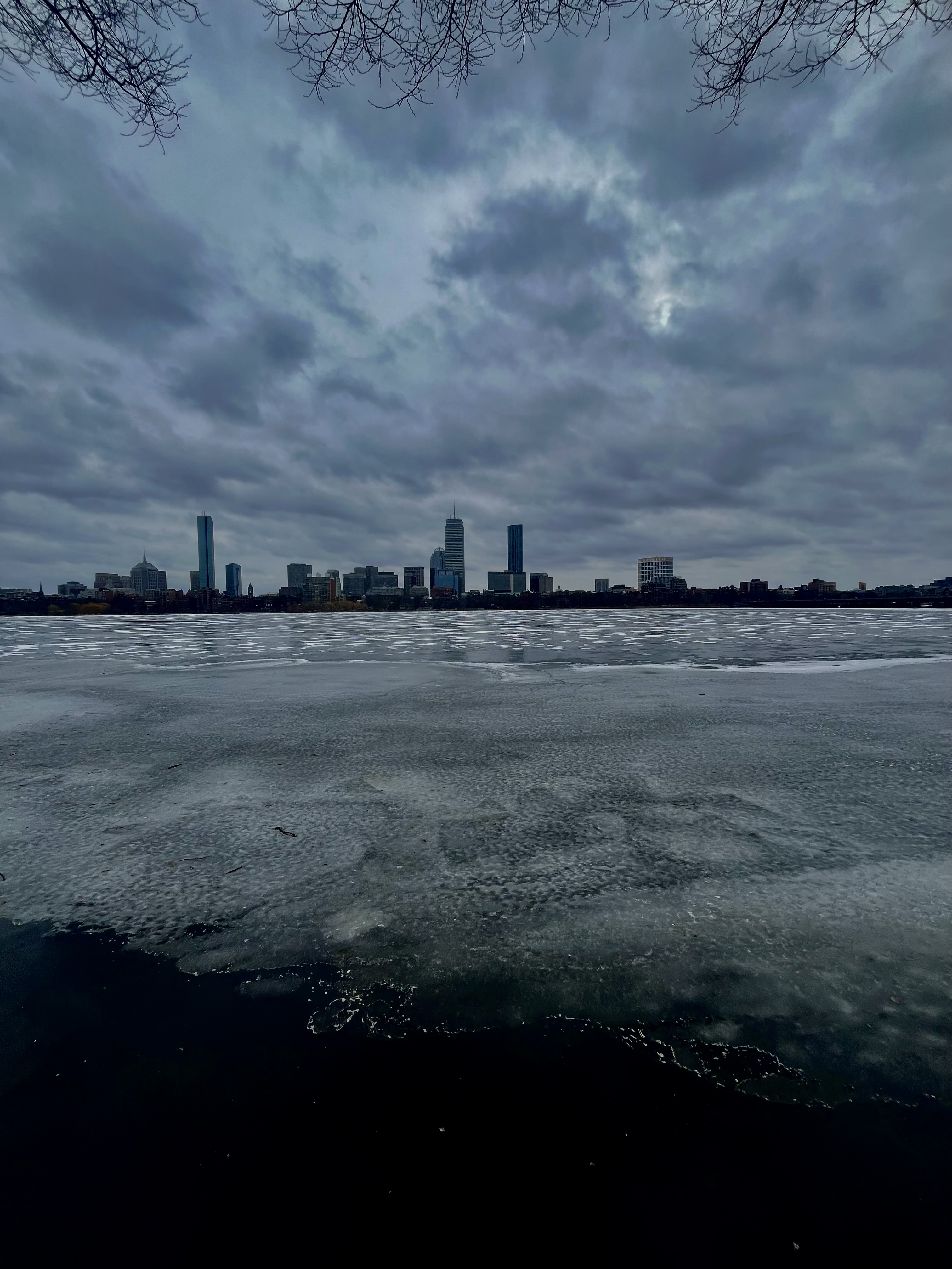 The boston skyline and iced water