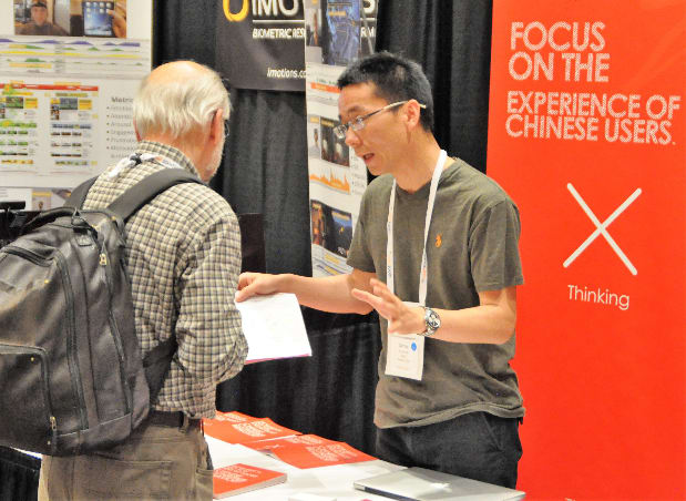 Photo of Nigel Bevans visiting a conference booth