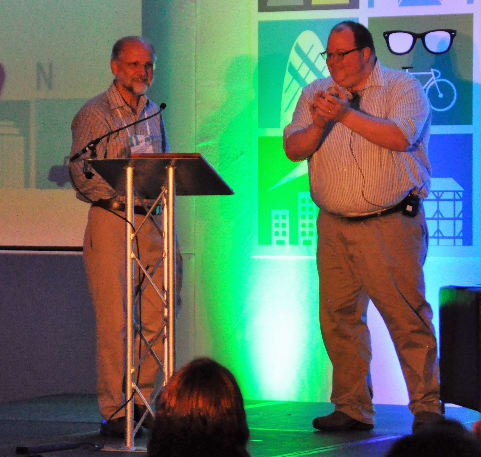 Photo of Nigel Bevans and Chris Hass on a stage