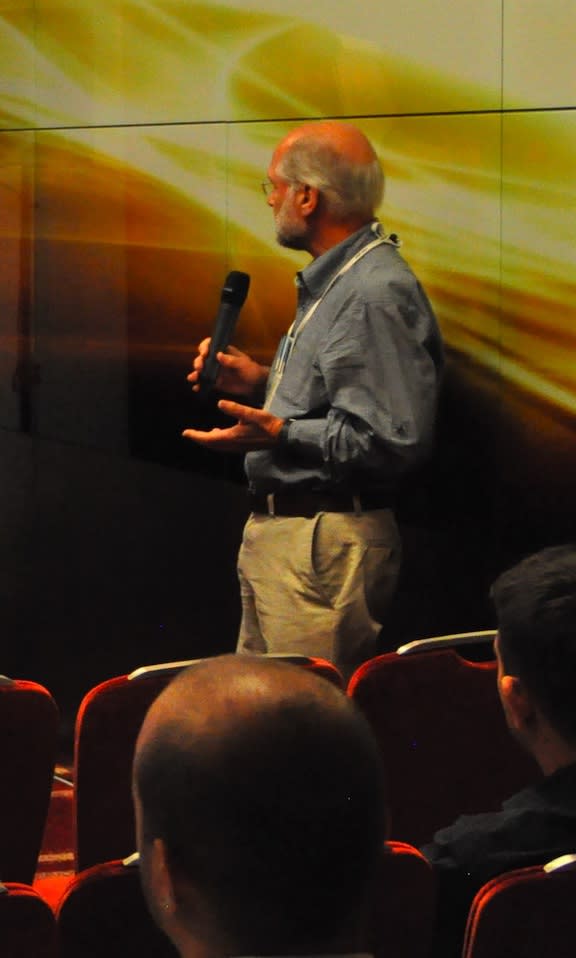 Photo of Nigel speaking to an audience.
