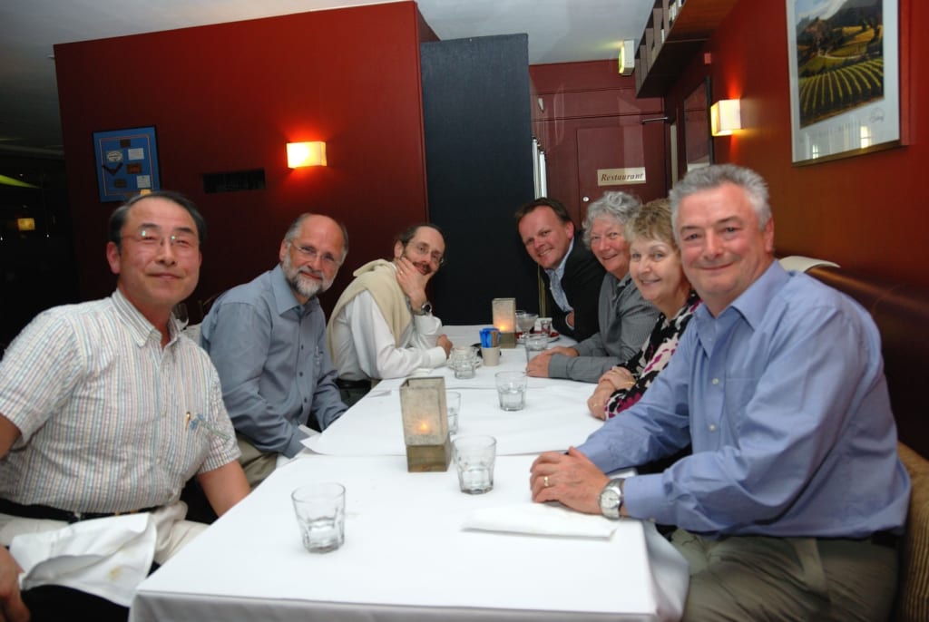 Group photo of Nigel with colleagues after a meal.