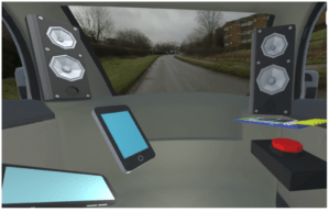 Participant's internal view of AV MaaS; HMIs include items like stereo speakers, a computer interface, cell phone, and emergency button