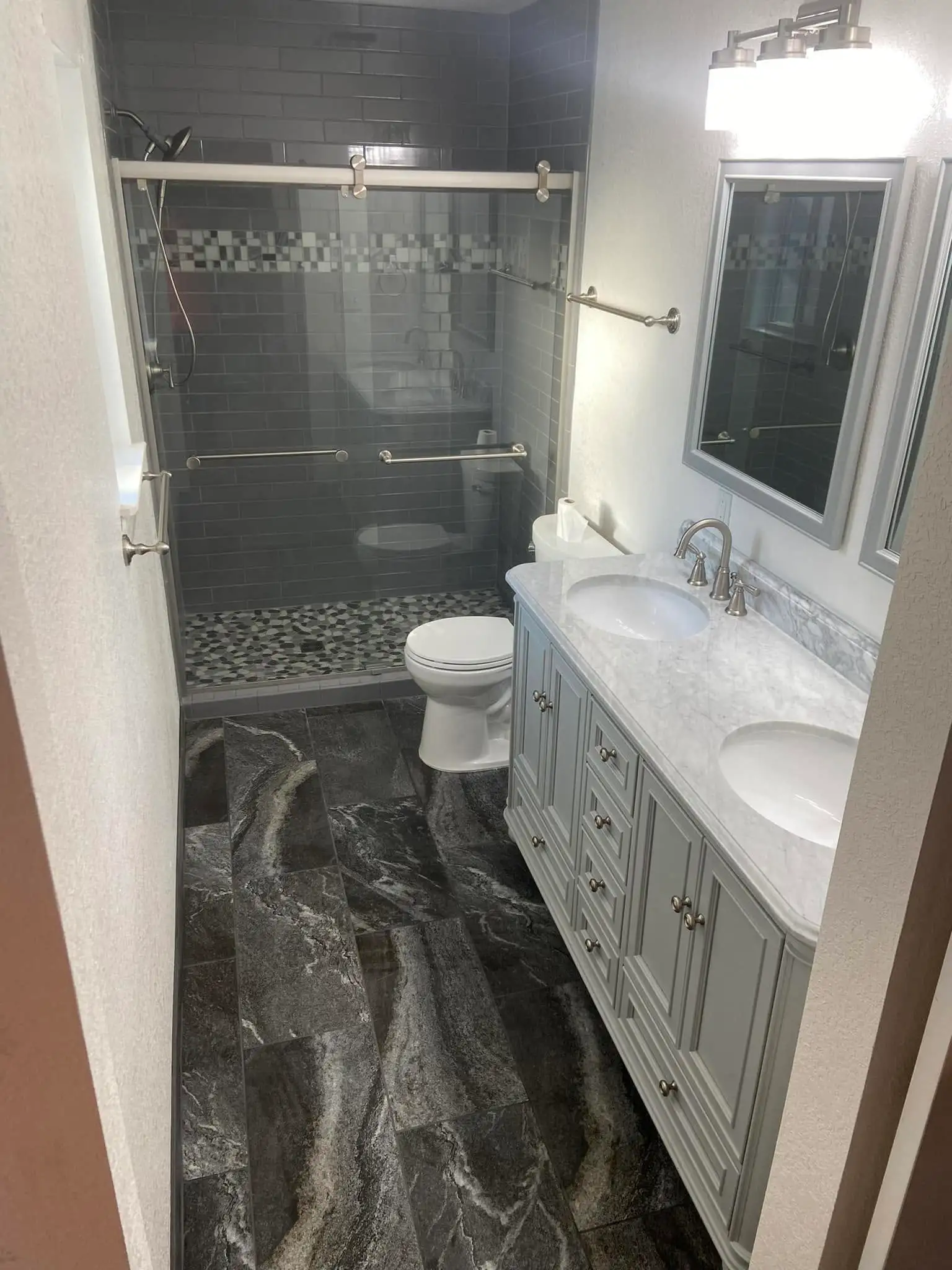 Bathroom flooring install by Hunter & Son Construction Inc.
