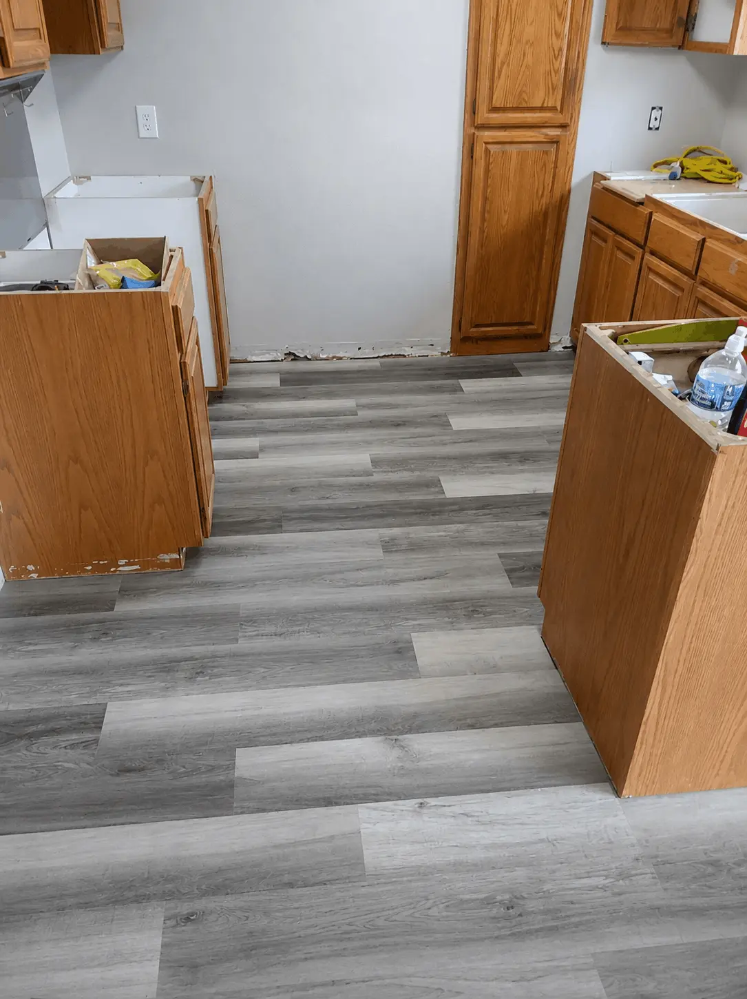 Freshly installed kitchen flooring by Hunter & Son Construction Inc.
