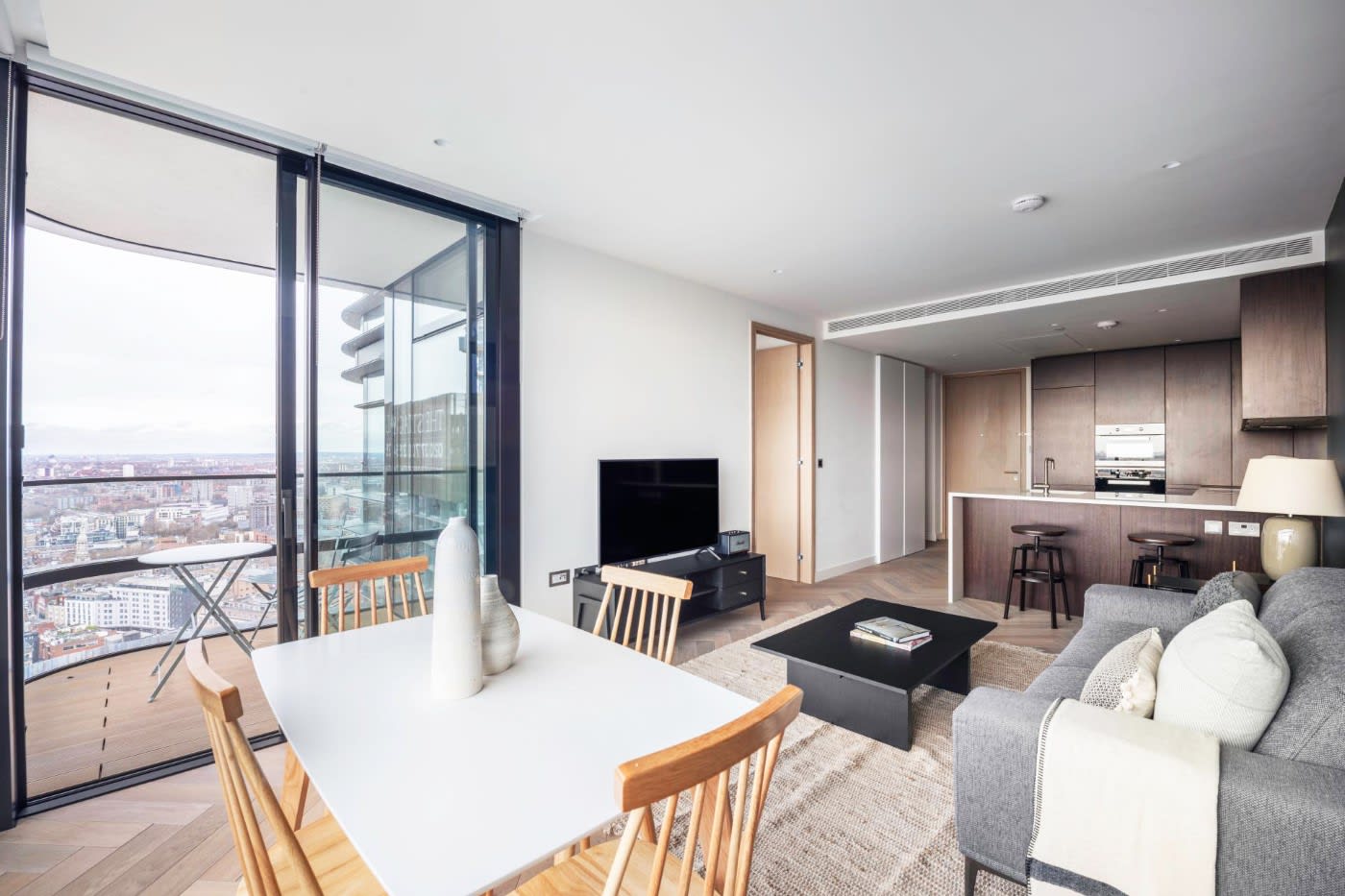Common area of a modern living room and kitchen in a furnished apartment Shoreditch London