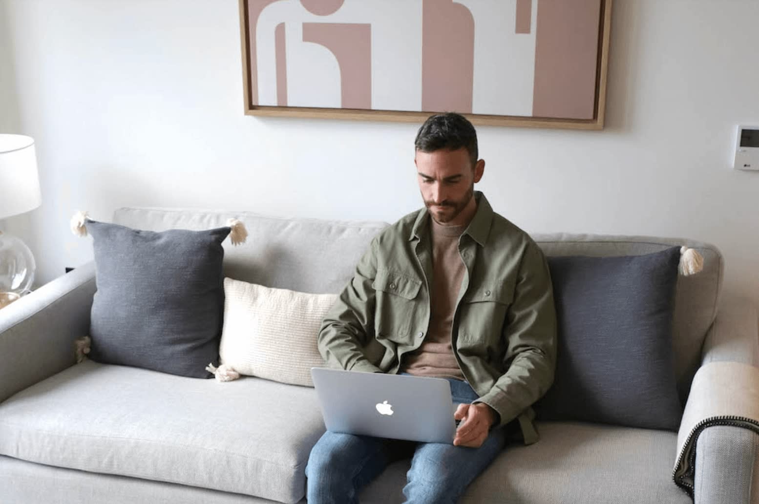 Man sitting on couch with laptop