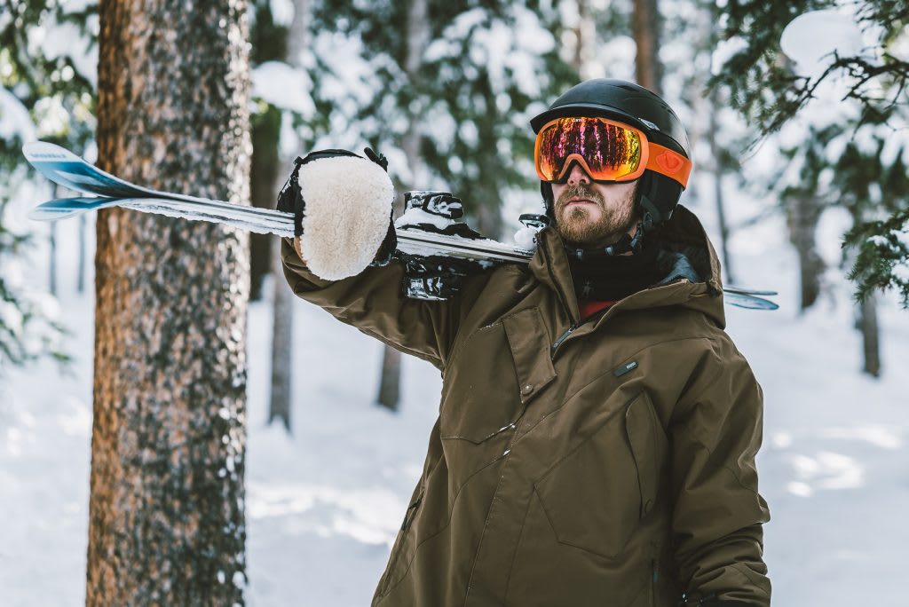 Male skier in the woods