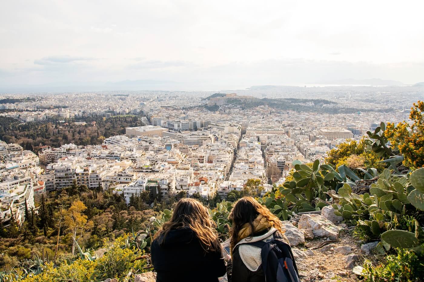 Two girls resting and looking out from Lycabettus Hill
