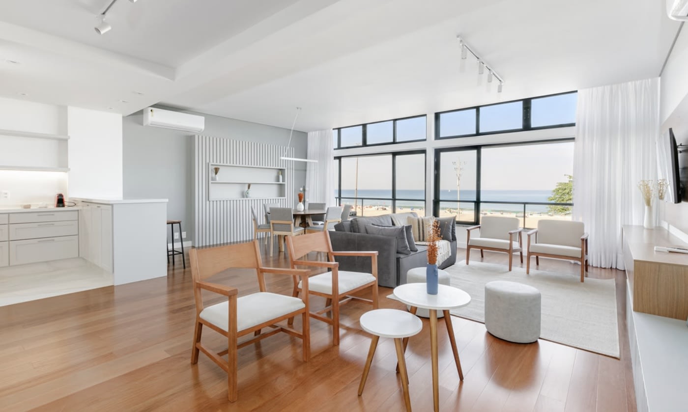 white colored living room with wooden floor in a Rio de Janeiro apartment