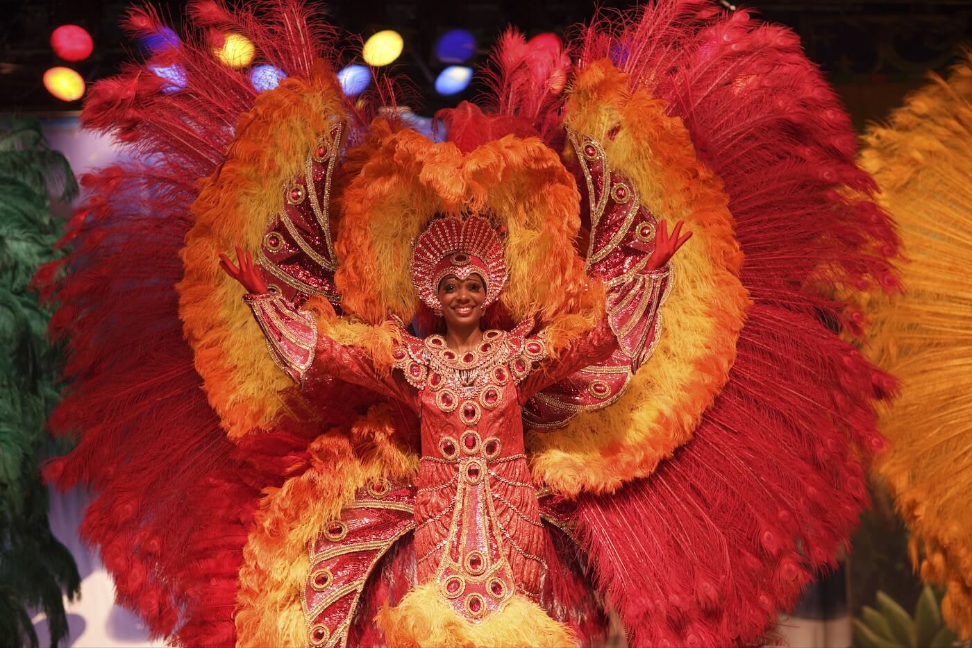 Woman in a red and orange costume for Carnival