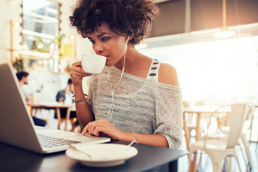 Woman drinking coffee outside