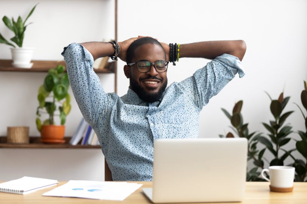 Happy employee at desk