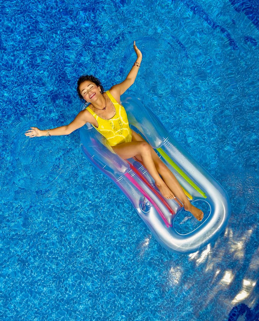 Woman floating in pool