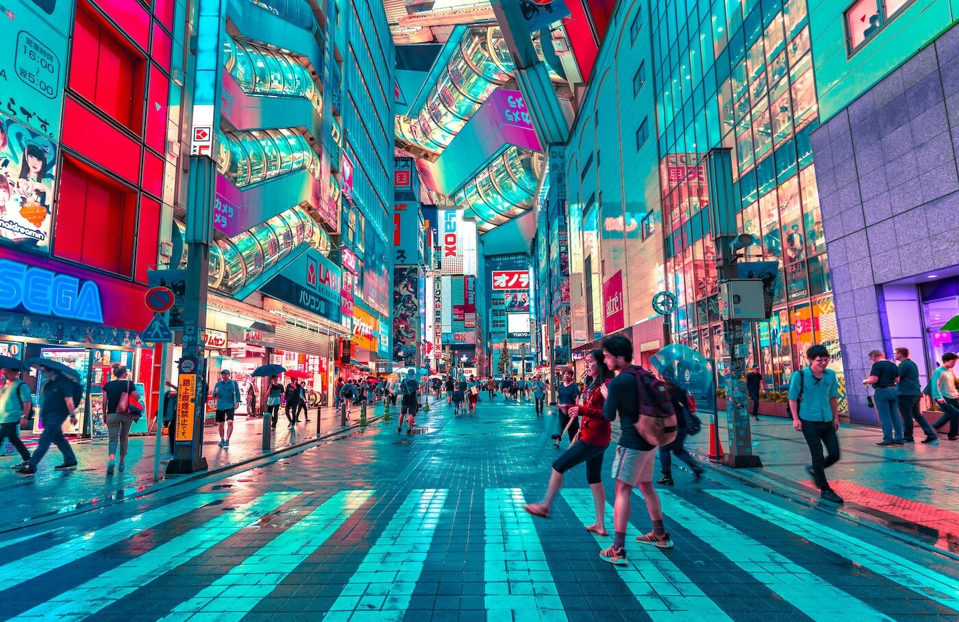 Bustling street lit up at night in Tokyo