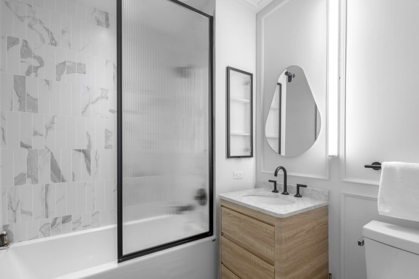 best neighborhoods Brooklyn beautiful minimal washroom with marble walls and wood sink