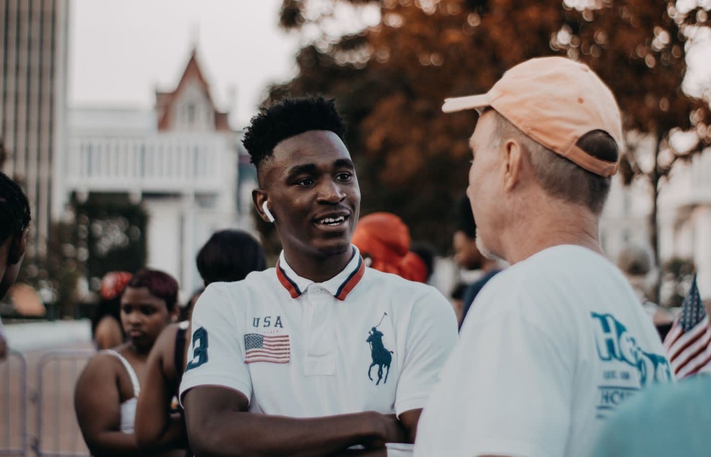 Two men having a conversation in a city street
