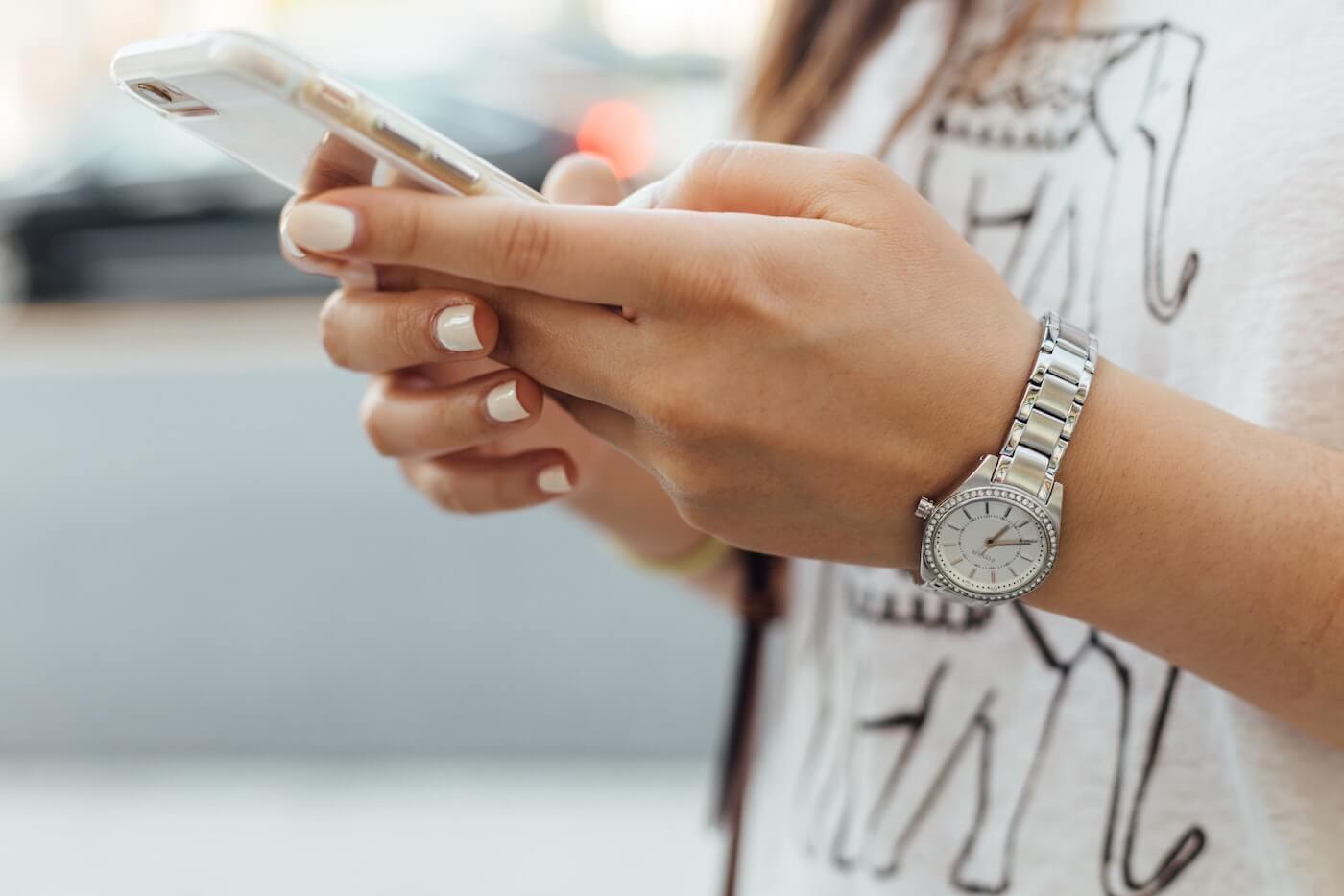 A woman uses a smartphone