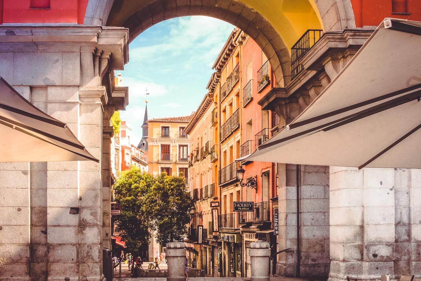 a shaded archway in madrid, spain