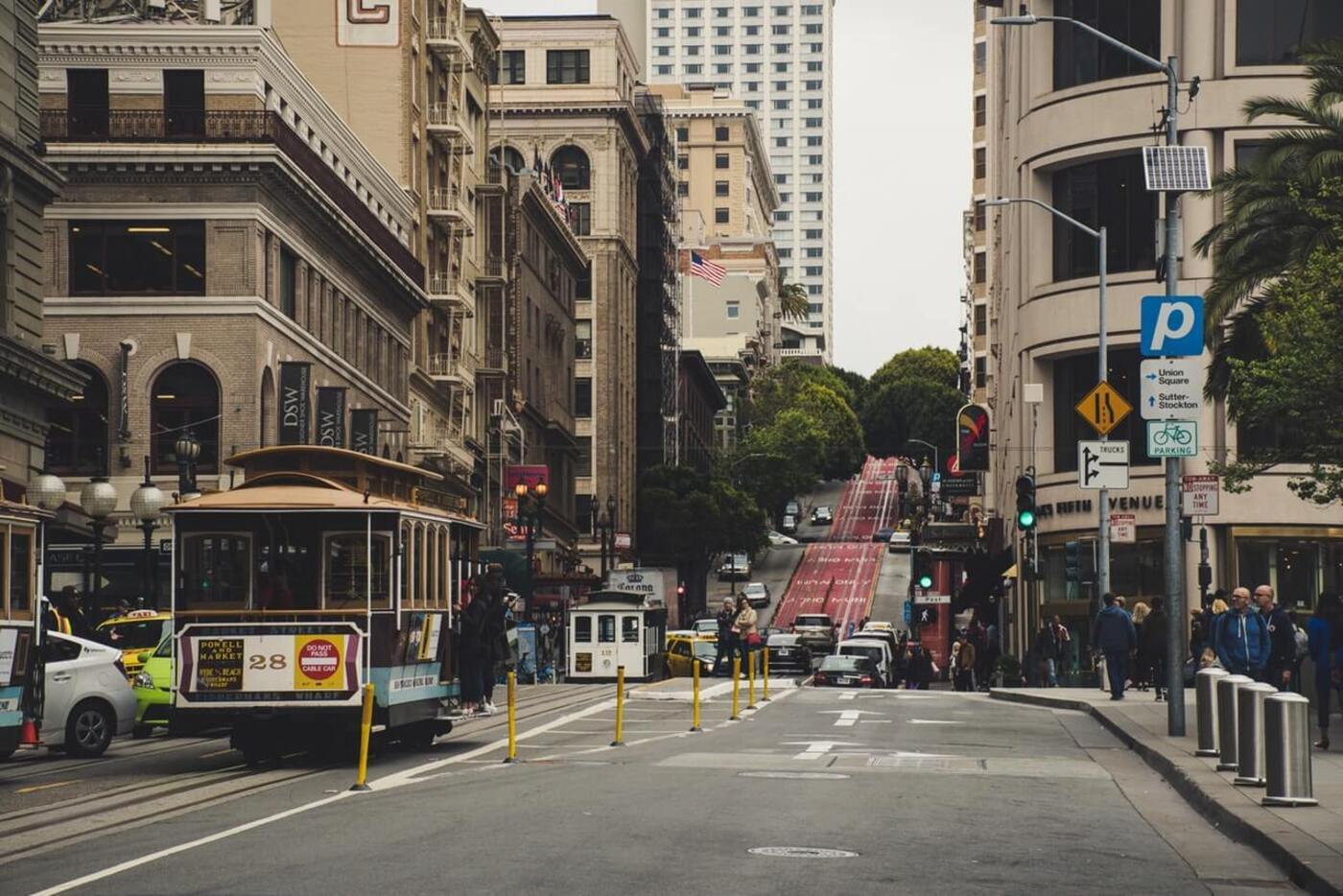 busy street with a moving Tram in San Francisco 